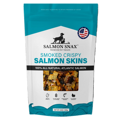 A package of Salmon Snax Smoked Crispy Salmon Skins, with an image of the product in a clear window, indicating it is a pet treat made from smoked and crispy salmon skins.